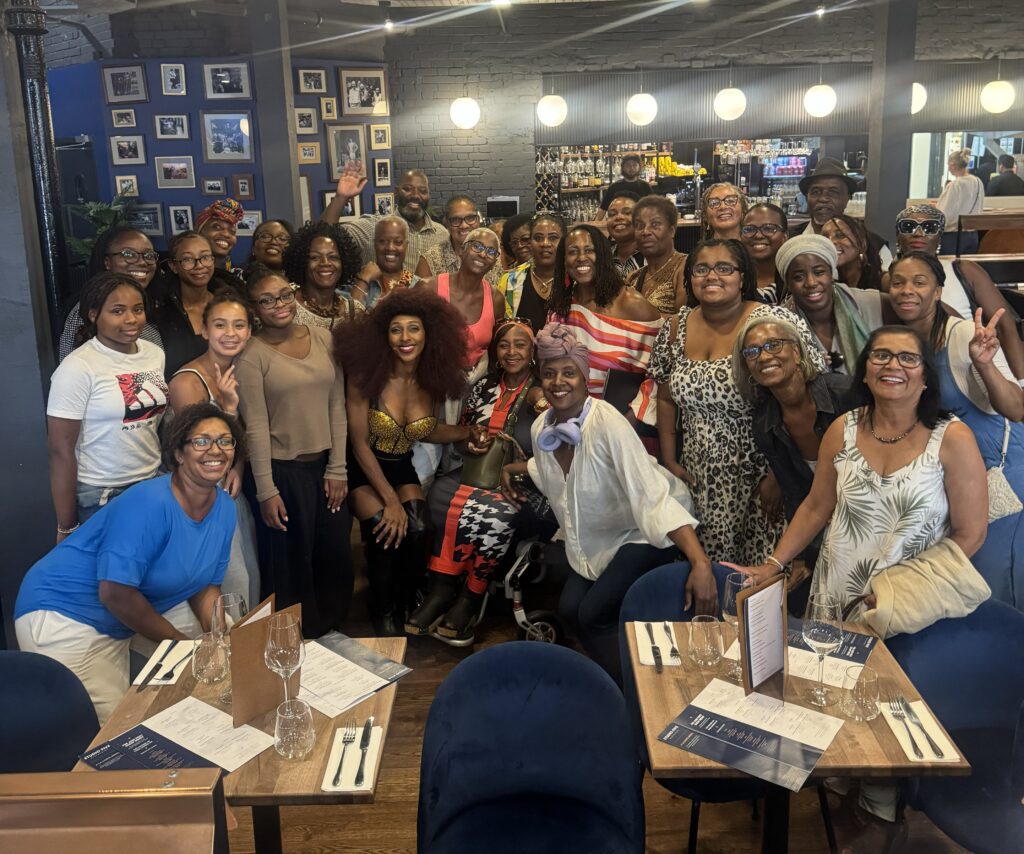 Members of The Arts & Culture Group gathered round restaurant tables at a get-together after a show