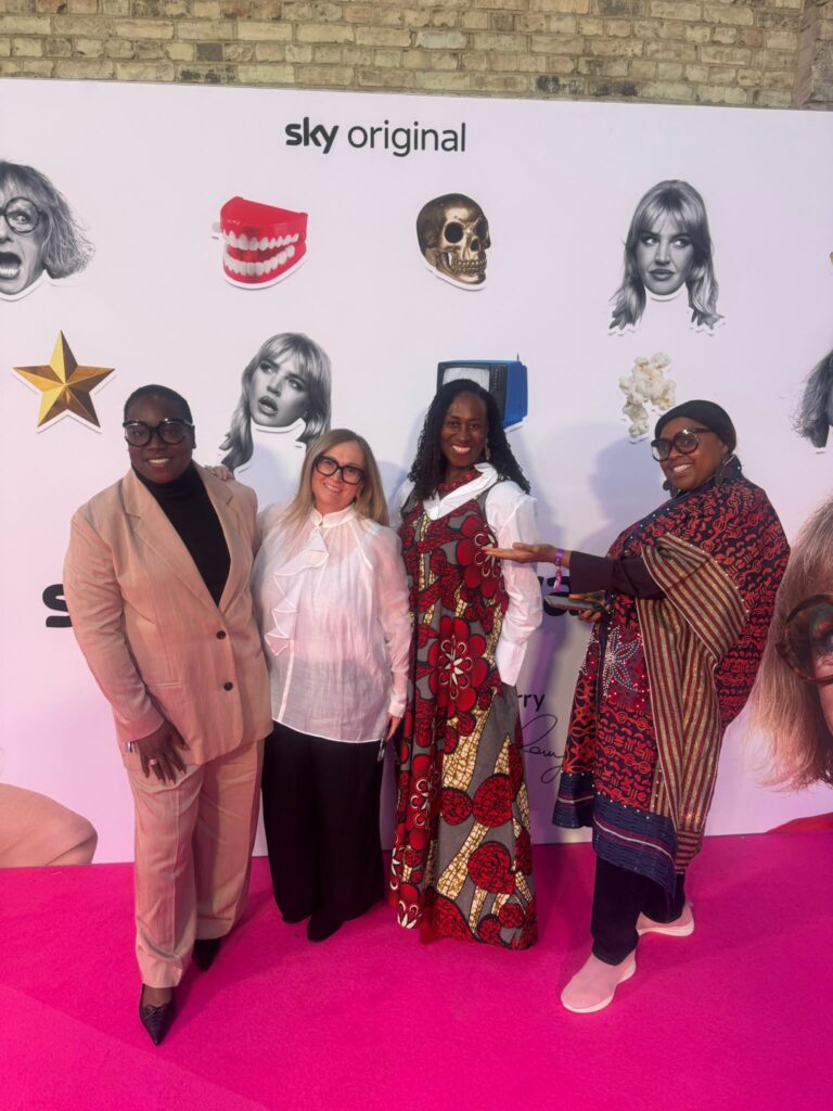 Elaine Grant with guests on the pink carpet at a Sky Arts event